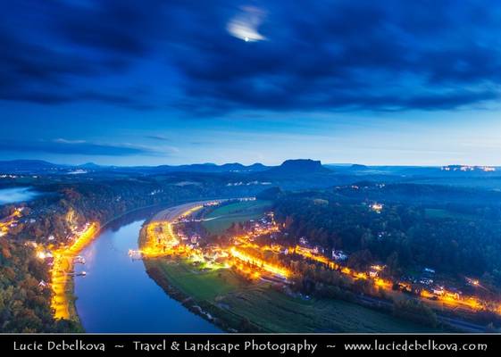 Germany - Saxon Switzerland National Park - Bastei - Rock formation towering 194 metres above the Elbe River at Dusk - Twilight - Blue Hour - Night with Full Moon