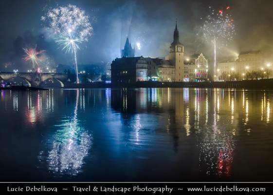 Czech Republic - Prague - Charles bridges over Vltava River & Lavka Towers at night during New Year's Firework display