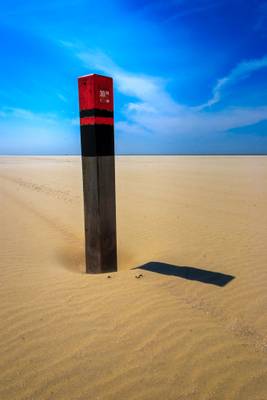 Red Pole in Sand
