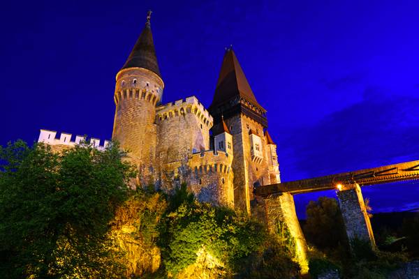 Walking under the stunning walls of Corvins' Castle at the blue hour