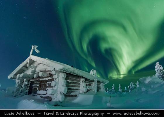 Finland - North of the Arctic Circle - Finnish Lapland under fresh cover of snow & Aurora borealis - Northern lights