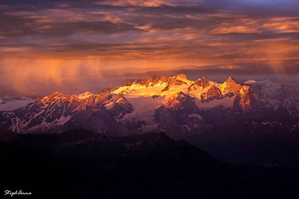 Sun shower over alps