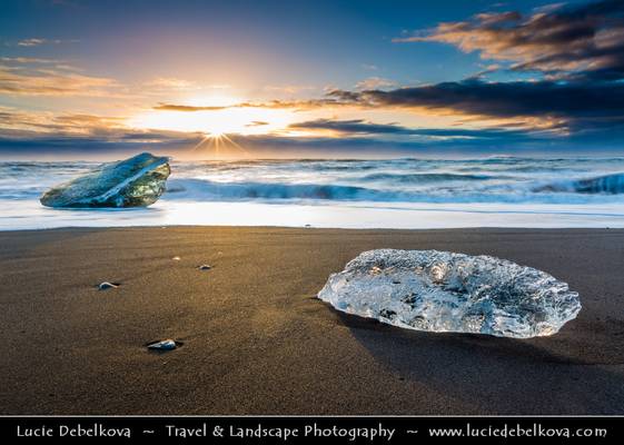 Iceland - Jökulsárlón Glacier Lagoon - Black Sand beach with Pieces of Ice during winter sunrise