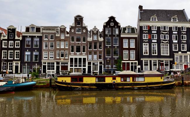 Yellow canal-boat in Amsterdam