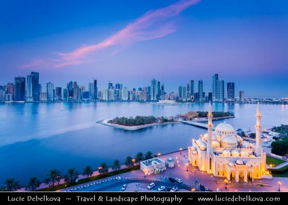 United Arab Emirates - UAE - Emirate of Sharjah - Cityscape around Khaled lagoon at Buhaira Corniche & Al Noor Mosque at Dusk - Twilight - Blue Hour - Night
