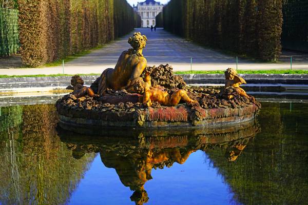 Perfect reflection in the Flora basin, Versailles gardens, Paris