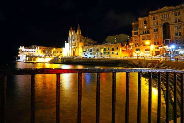 Church of Our Lady of Mount Carmel across Balluta Bay at night, Malta