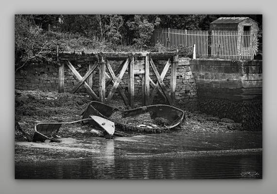 Old jetty and sunken boats