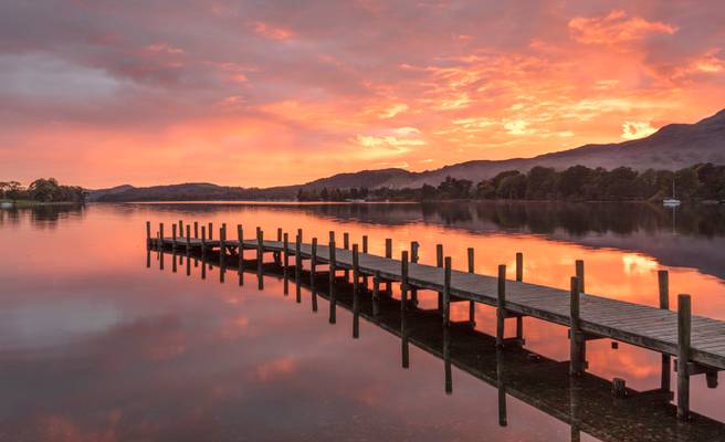 Incredible sunset over Monk Pier at Coniston Water, Lake District