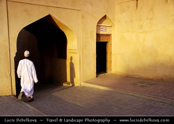Oman - Lonely Man Walking through Old Souq of Nizwa During Late Afternoon