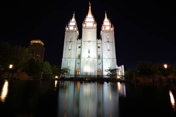 Salt Lake City by night. Mormon Temple & its reflection