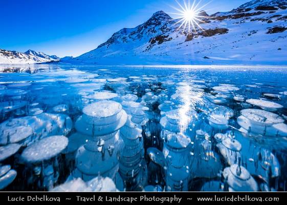 Switzerland - Alps - Deep frozen Lago Bianco - White Lake with surreal bubbles