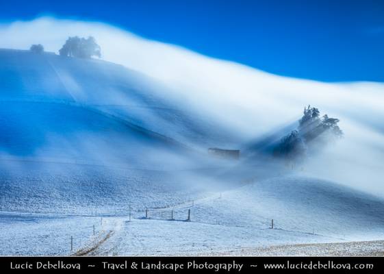 Switzerland - Jura Mountains submerged in fast moving mist