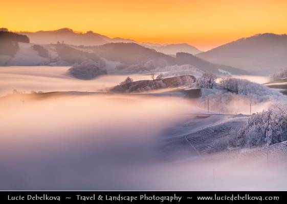 Switzerland - Jura Mountains submerged in mist at Sunset