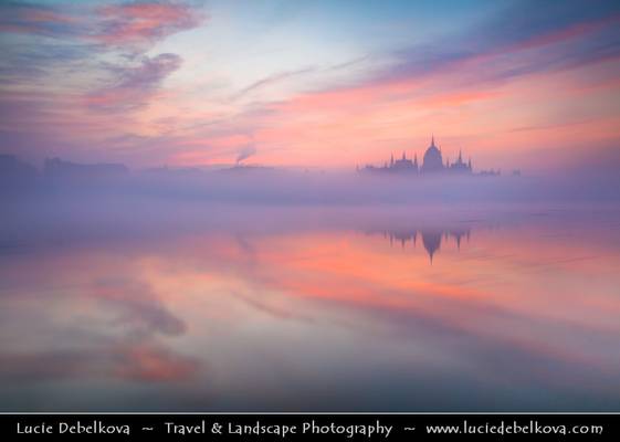 Hungary - Budapest - Hungarian Parliament Building - Iconic landmark reflected at Danube River during misty sunrise
