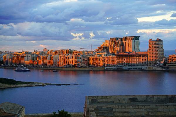 Sliema in the sunset reddish light seen from Valletta ramparts, Malta