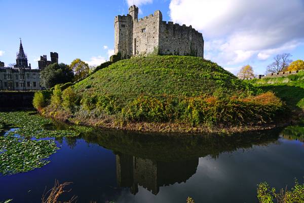 Norman Keep reflecting in the moat, Cardiff Castle, UK