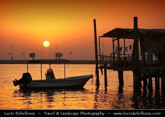 Bahrain - Sunset over traditional fisherman village at Muharraq