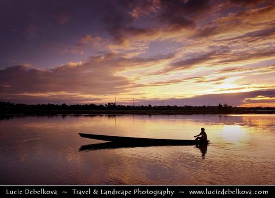 Laos - Lonely Fisherman on Mekong River in Vientiane at the Sunset