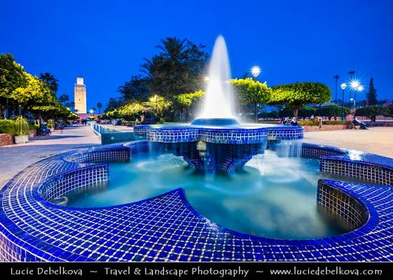 Morocco - Marrakech - UNESCO - Iconic Minater of Koutoubia Mosque & Lalla Hasna Park fountain at Dusk - Twilight - Blue Hour - Night