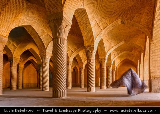 Iran - Shiraz - Mysterious Woman in Chador walking in Vakil Mosque