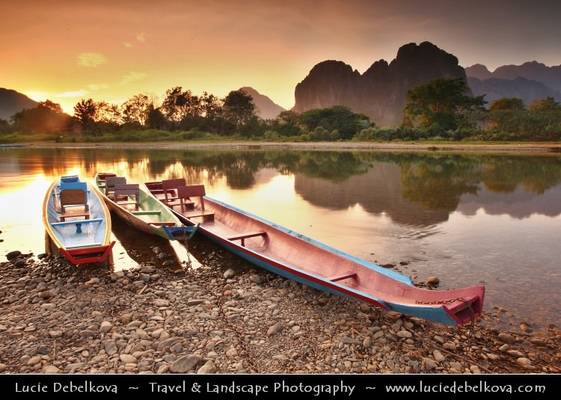Laos - Golden Sunset behind Limestone Hills and Nam Song River in Vang Vieng