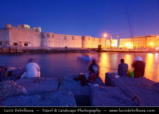 Egypt - Alexandria - Fishing at Fort Qaitbey lit at Dusk - Blue Hour - Twilight - Blue Hour - Night