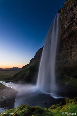Behind Seljalandsfoss waterfall in the twilight - #Iceland