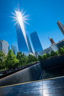 The Freedom Tower lights up the 9/11 Memorial