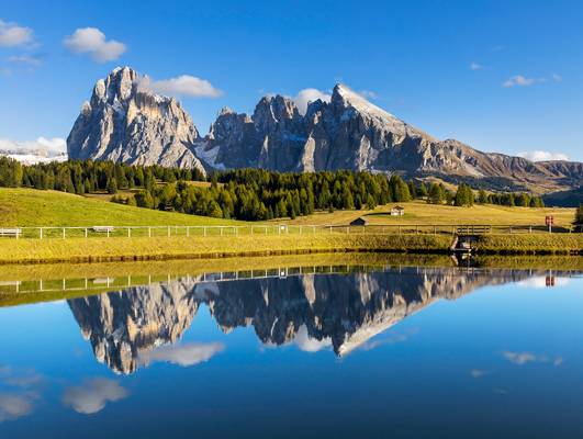 Reflection of Sassolungo Range, Alpe di Siusi, Dolomites, Italy