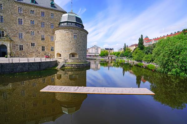 Örebro Castle reflecting in Svartån river, Sweden