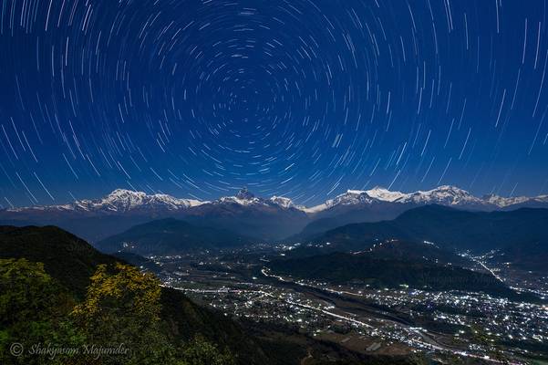 Star trails over the moonlit Annapurna Range from Sarangkot, Nepal