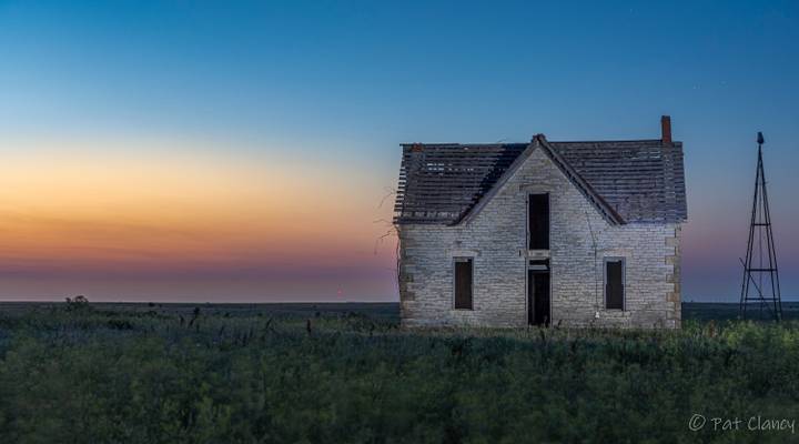 Sunset starts to fade at the abandoned Dr W.B. Jones home build in  1878 on the Kansas plains