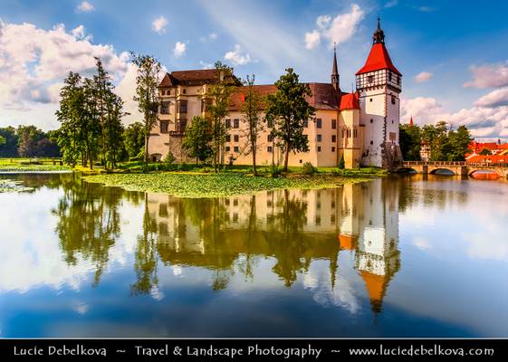 Czech Republic - Blatna Water Castle - Zamek Blatna reflected in the surrounding lake during sunny summer day