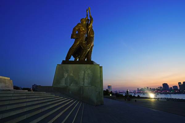 Worker, intellectual & peasant sculpture at sunset, Pyongyang Juche Monument