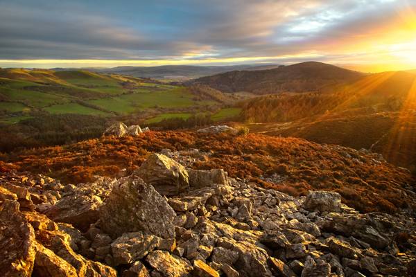 Sun setting behind Black Rhadley Hill