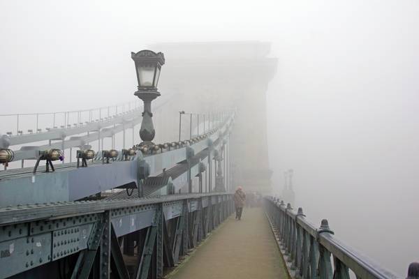 Foggy Budapest. Obscure shape of the Chain Bridge