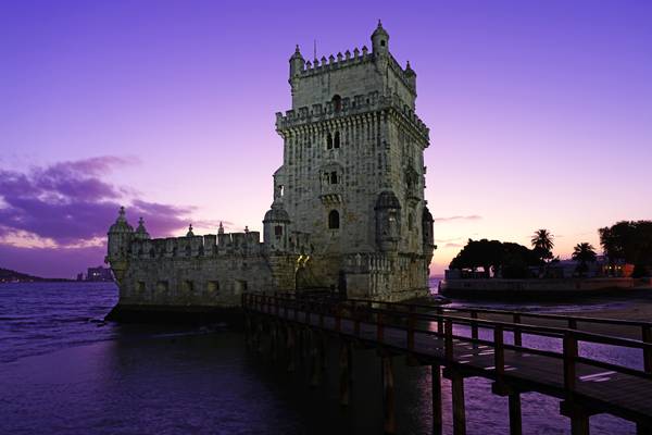 Reddish sunset sky over Belém Tower, Lisbon