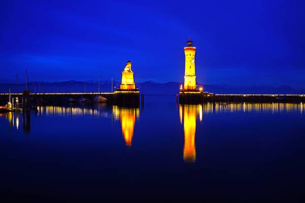 Iconic view of Lindau Lion & Lighthouse at the blue hour, Germany