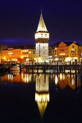 Lindau by night. Mangturm reflecting in the Lake Constance