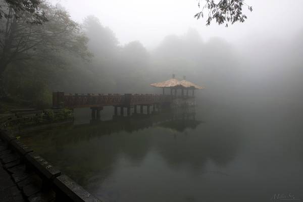 An Oriental Pavilion on the Pond in the Fog