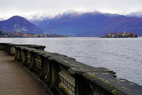 Promenade on the lakeshore with the view to Borromean Islands, Stresa, Italy