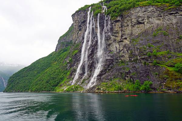Kayaking under the Seven Sisters waterfall, Geirangerfjord, Norway