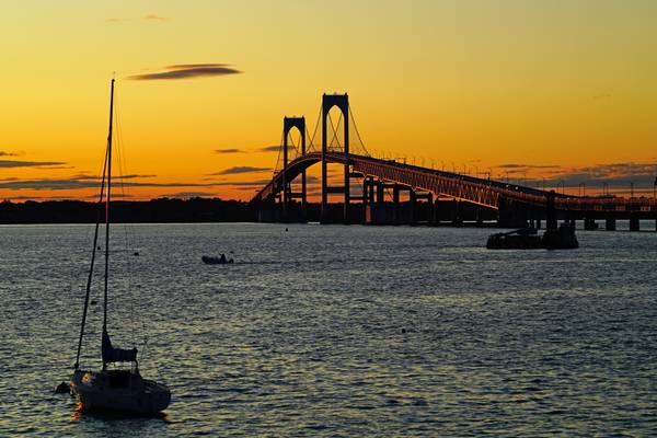 Sleeping yacht & Newport bridge at sunset, Rhode Island