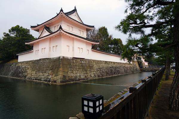 Nijo Castle wall with pink illumination at twilight, Kyoto