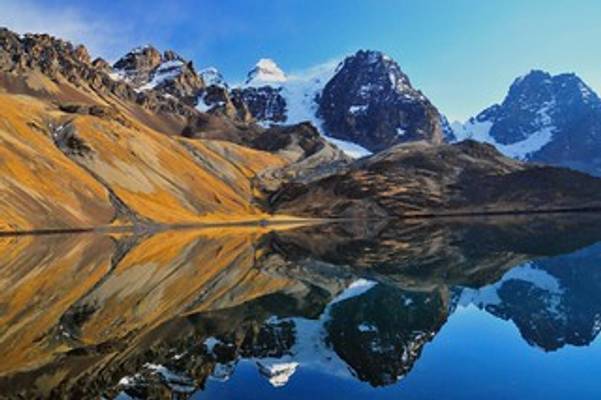 Condoriri mirrored in the waters of Laguna Chiar Khota, Bolivia