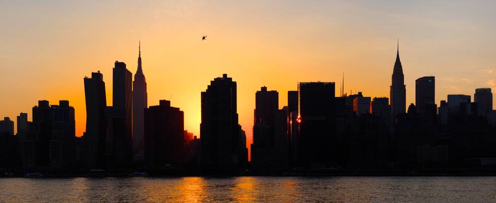 Midtown skyline at sunset - view from Long Island, New York, USA
