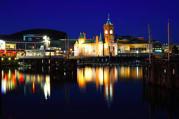 Cardiff by night. Pierhead Building reflrcting in the bay