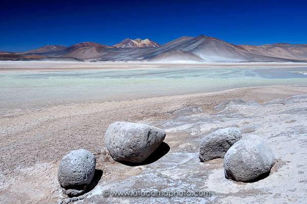 Boulders at the colorful Salar de Aguas Calientes, Atacama altiplano, Chile