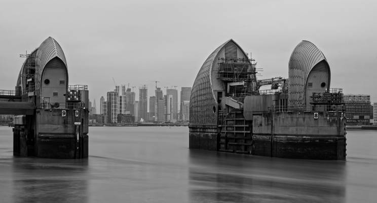 Thames Barrier, London with Canary Wharf in background